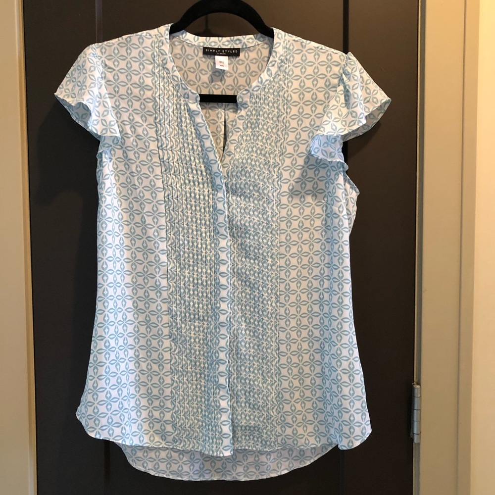 Simply styled white and mint button down blouse